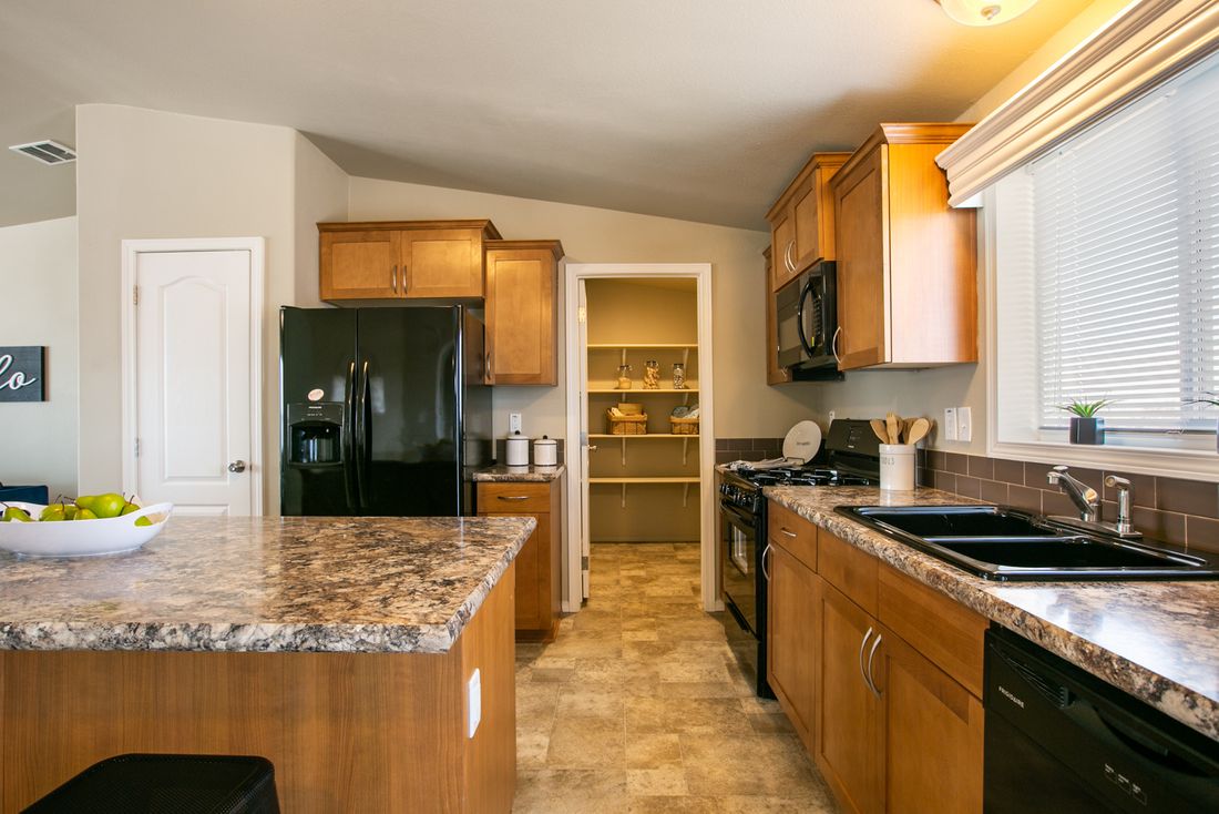 The THE WAVE Kitchen. This Manufactured Mobile Home features 4 bedrooms and 2 baths.