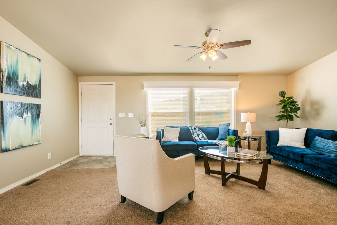 The THE WAVE Family Room. This Manufactured Mobile Home features 4 bedrooms and 2 baths.